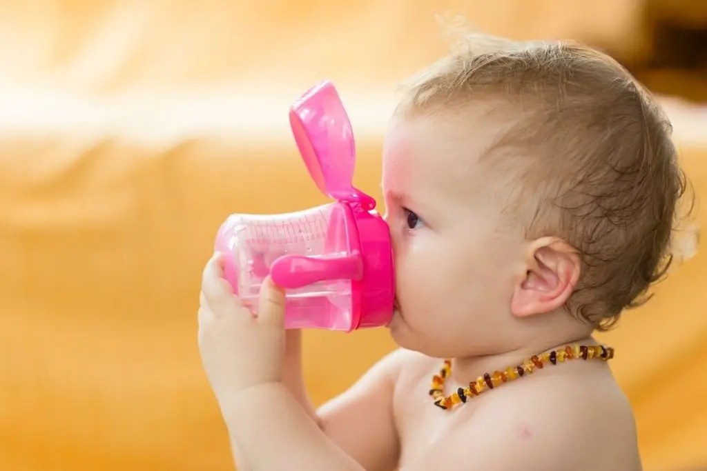 A baby wearing a teething necklace, which is considered not safe by paediatricians. 